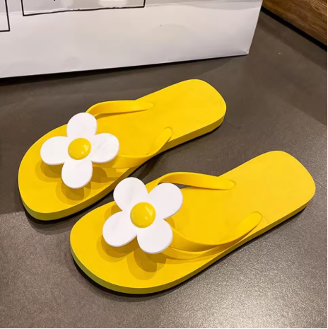 Daisy embellished flip flops