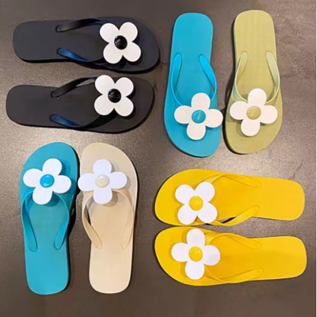 Daisy embellished flip flops
