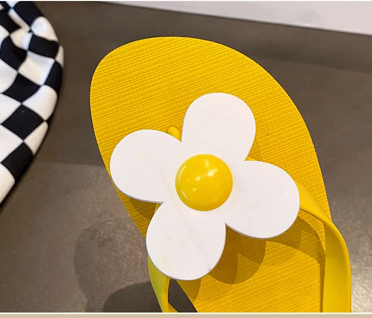 Daisy embellished flip flops